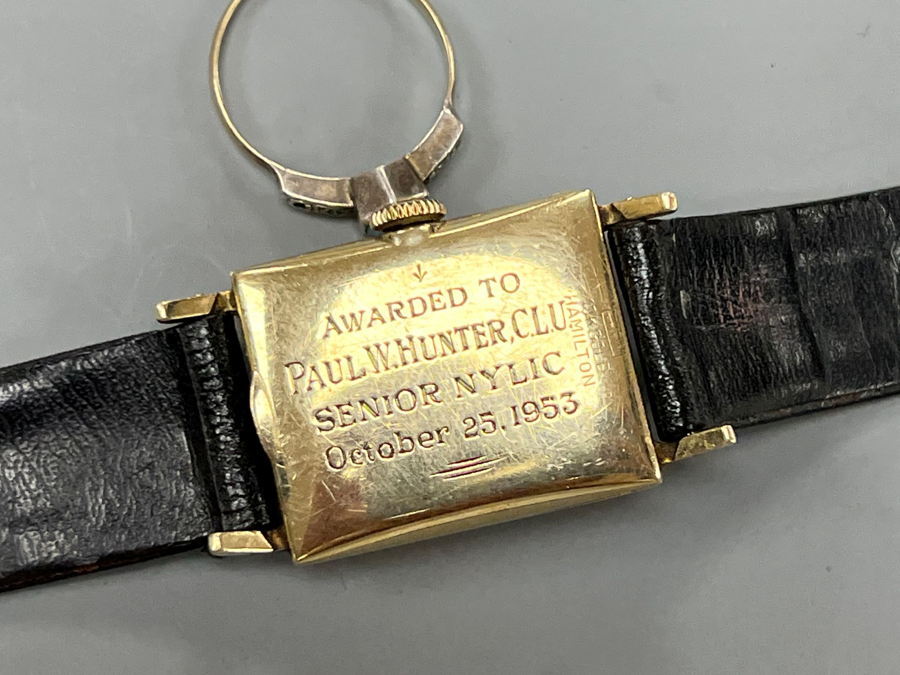 A gentleman's 10k yellow metal Hamilton manual wind wrist watch and a 9ct and white metal ring.